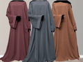 Three Nidha Abayas in different colors displayed in a row with their backs towards the camera, showcasing the wide sleeve and bell sleeve features.