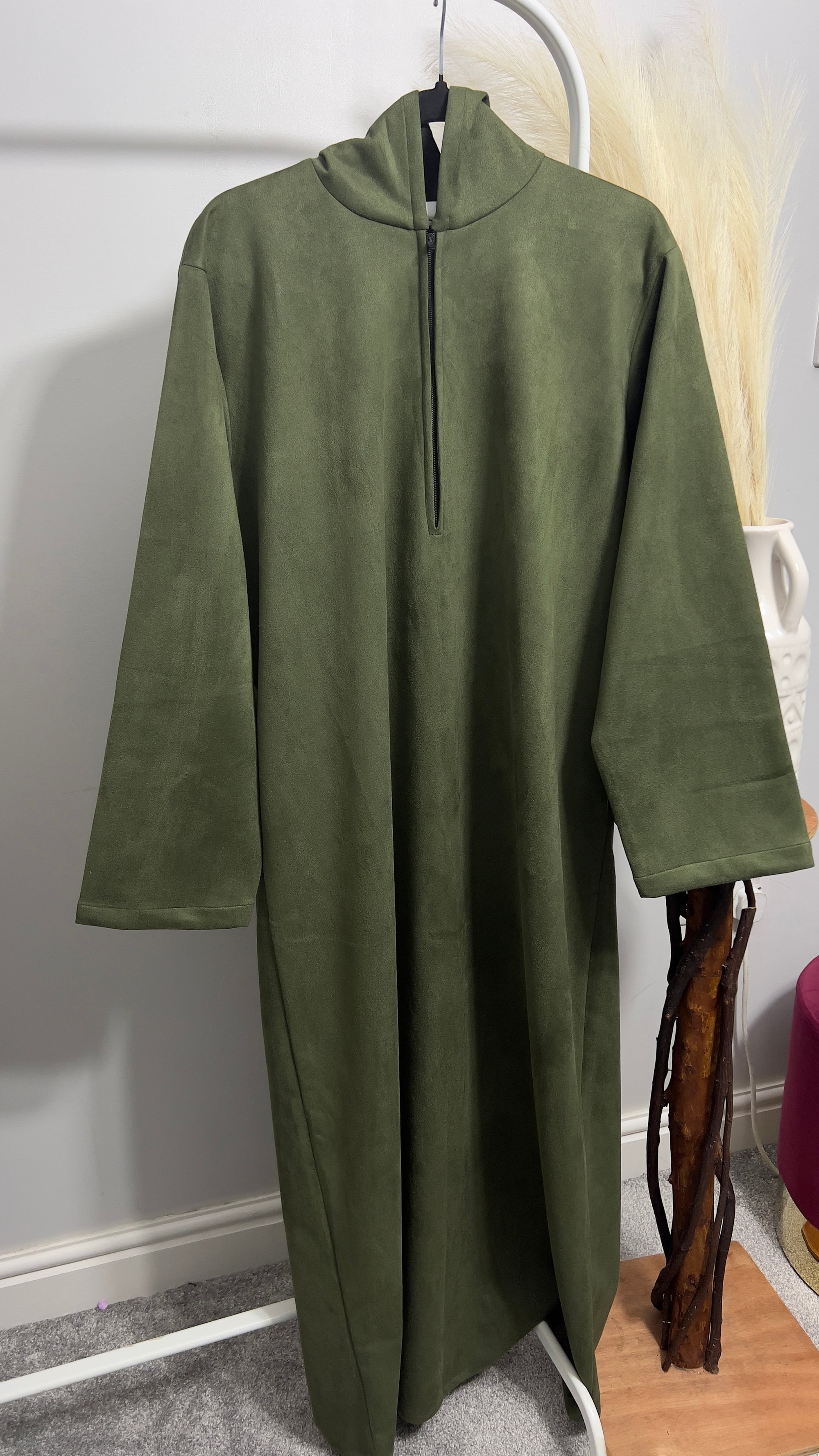 hooded and long sleeve thobe in suede material in green colour worn by man