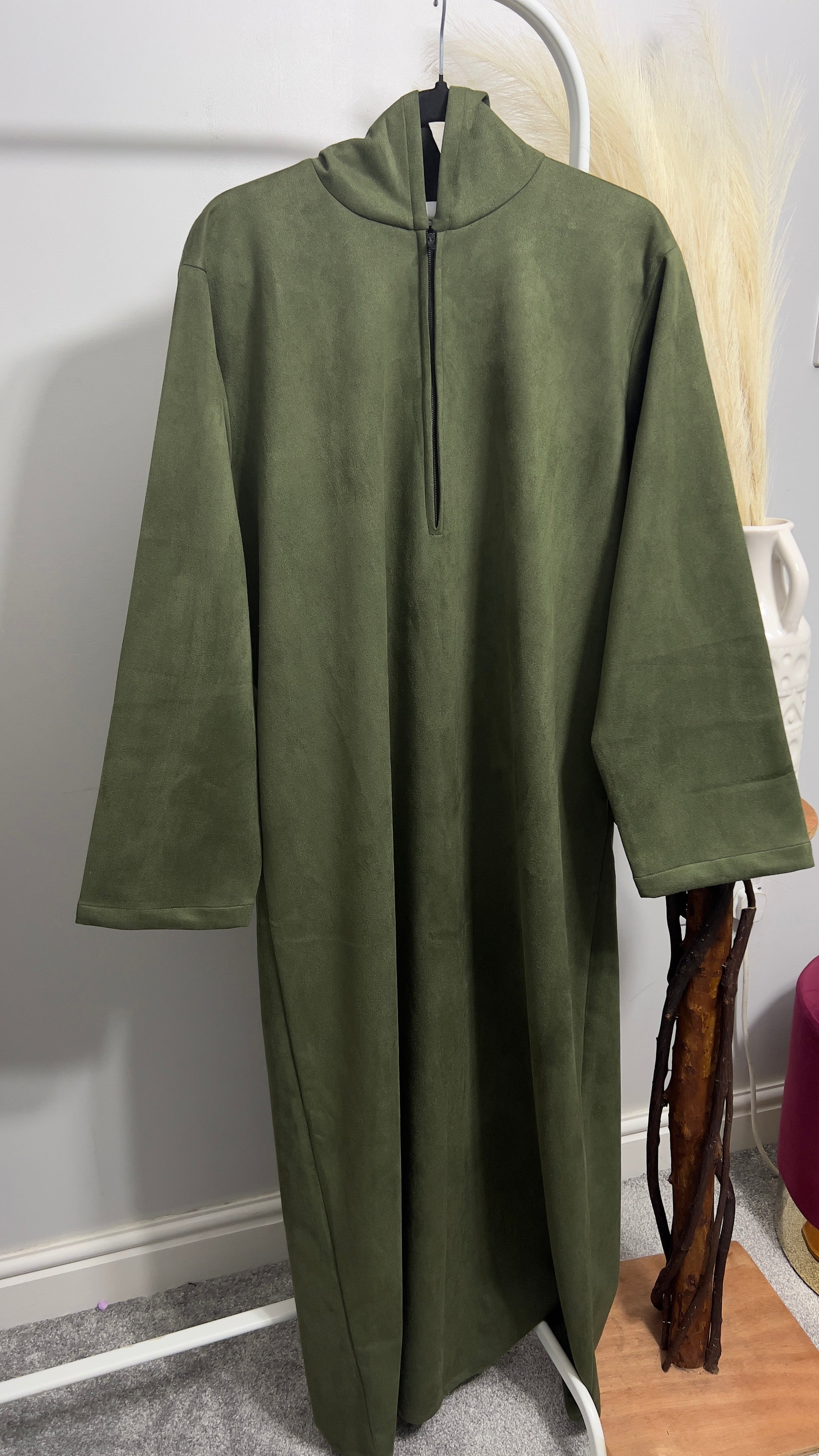 hooded and long sleeve thobe in suede material in green colour worn by man