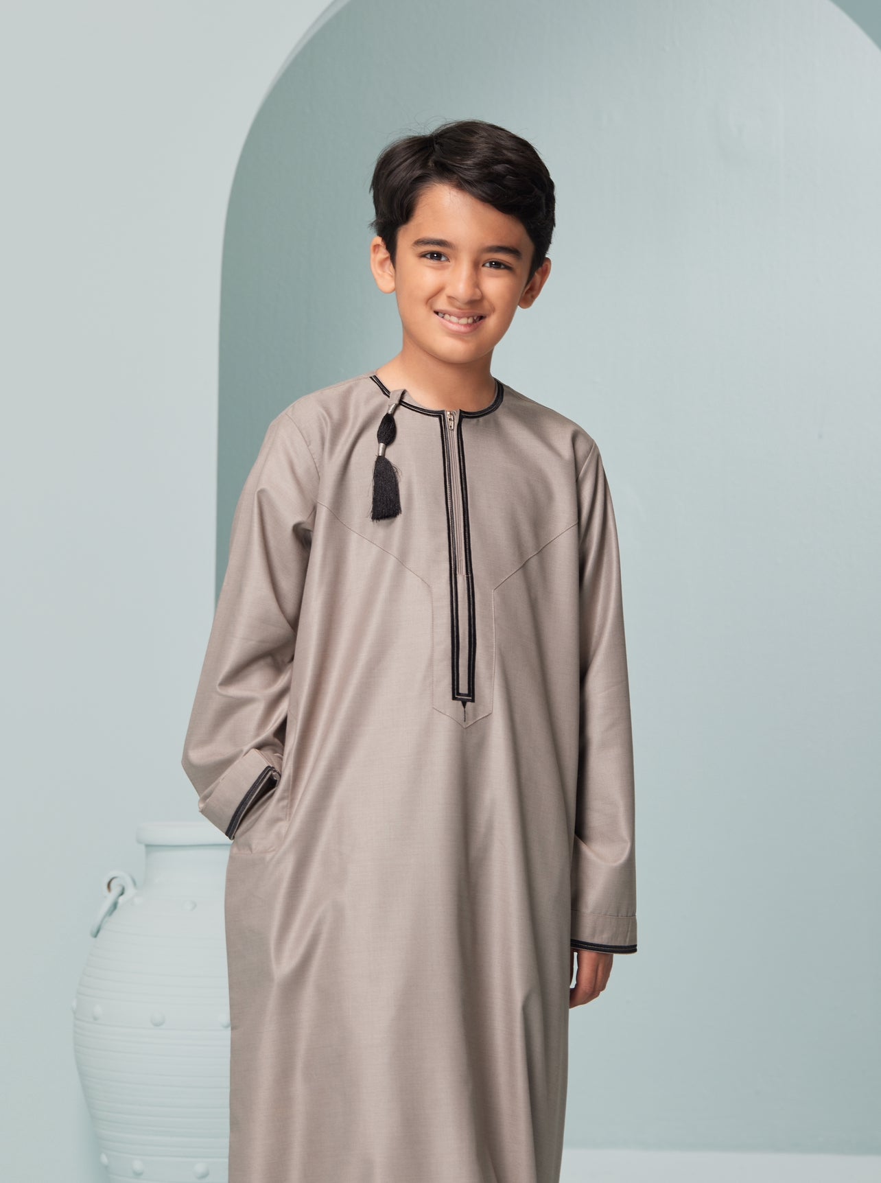 Kids Embroidered Beige Thobe with Black Tassel Ages 3-13 Kids Omaar thobe in Beige, Thobeluxe stylish embroidered Omani-style thobes for boys saudi thobes