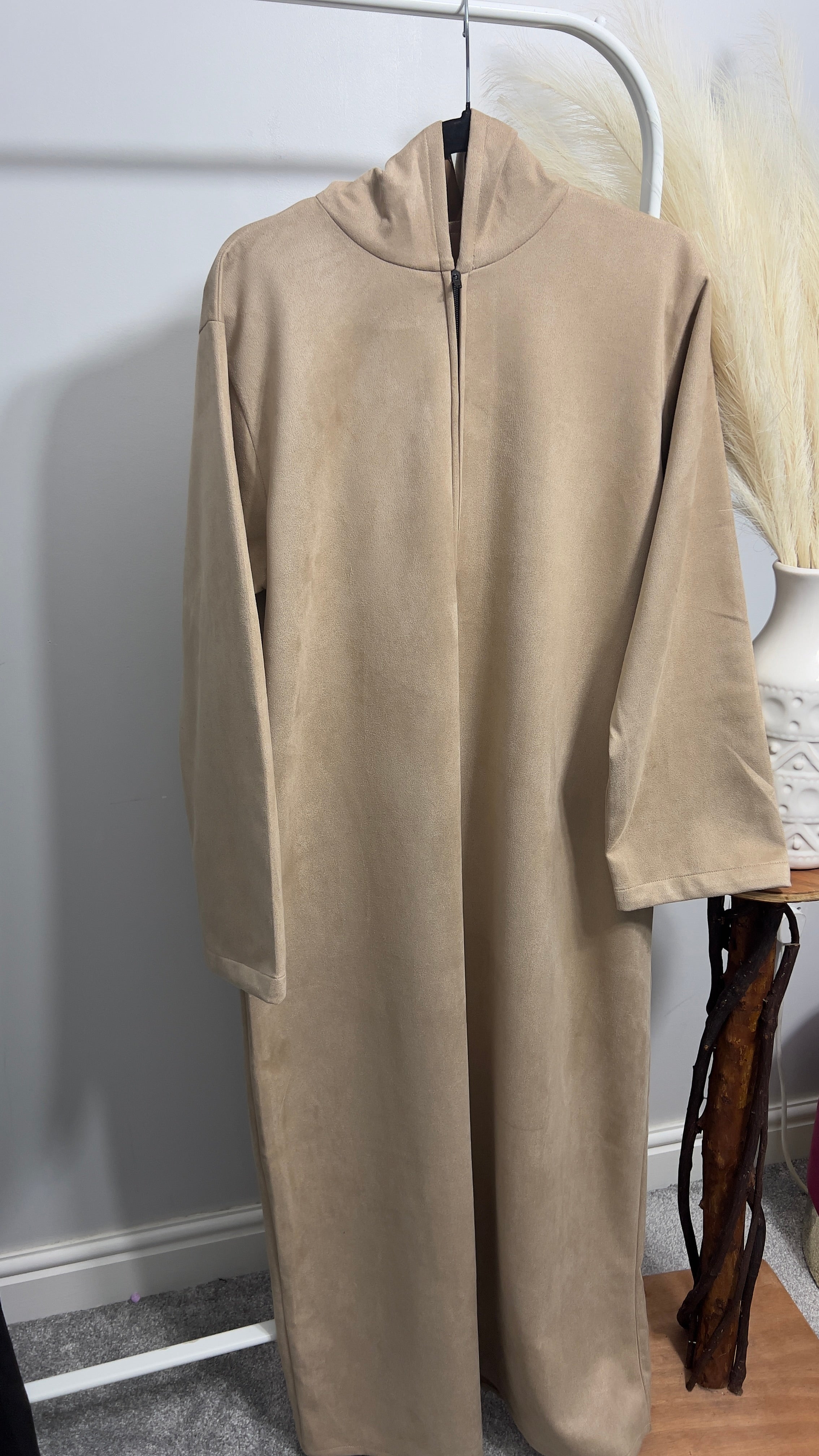 hooded and long sleeve thobe in suede material in beige colour worn by man