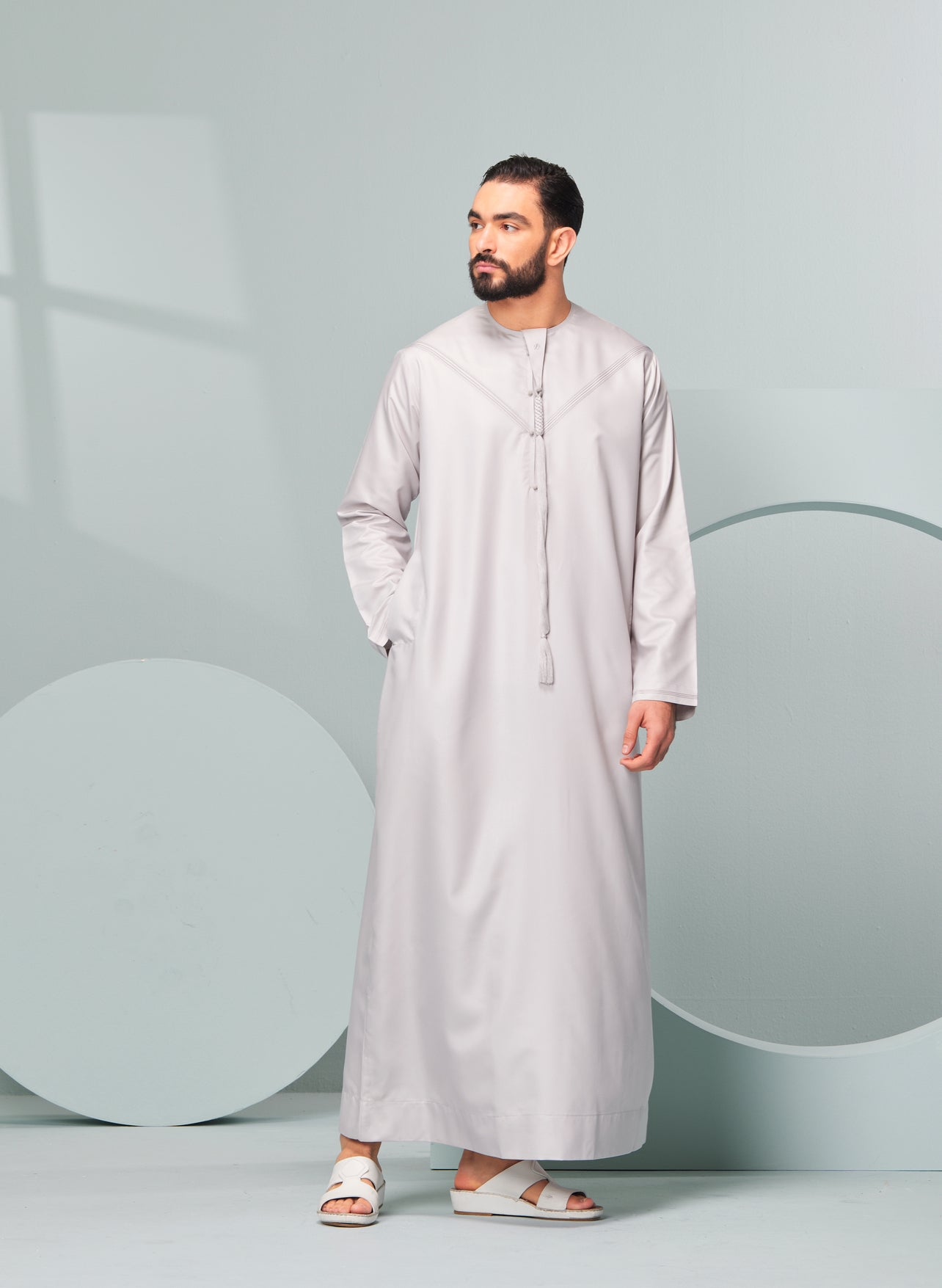 Men's Premium Emaar Thobe in Stone Beige with Tassel, Emaar, our luxurious Emirati style thobe made in the UAE. Authentic Saudi Thobes by Thobeluxe