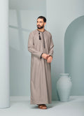 Men's Omani Style Thobe in Beige with Black Tassel, premium thobes, Omaar clothing thobeluxe stylish mens embroidered Omani style thobe
