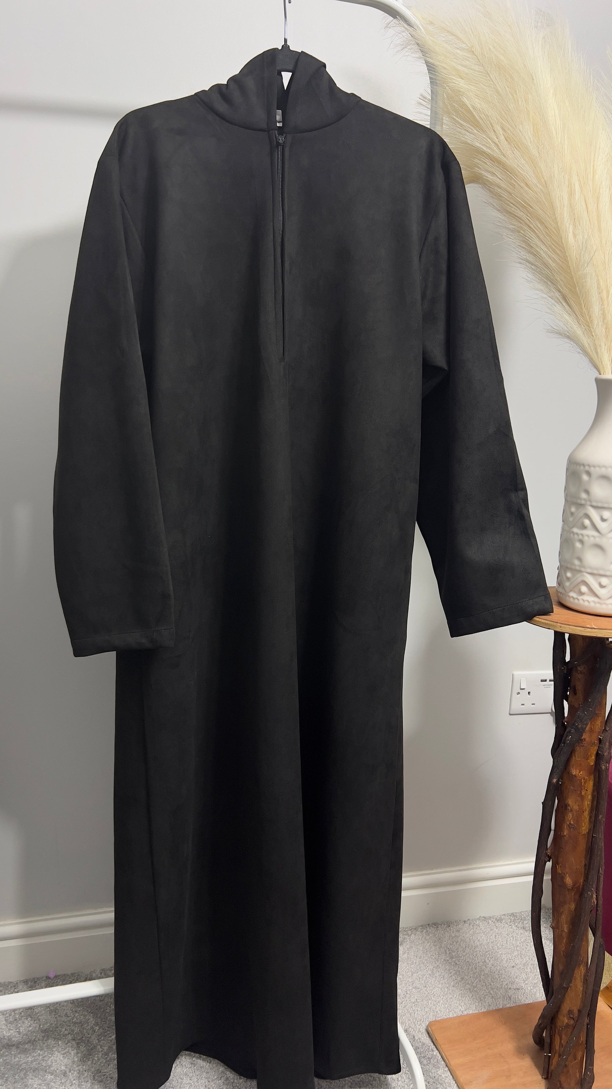 hooded and long sleeve thobe in suede material in black colour worn by man
