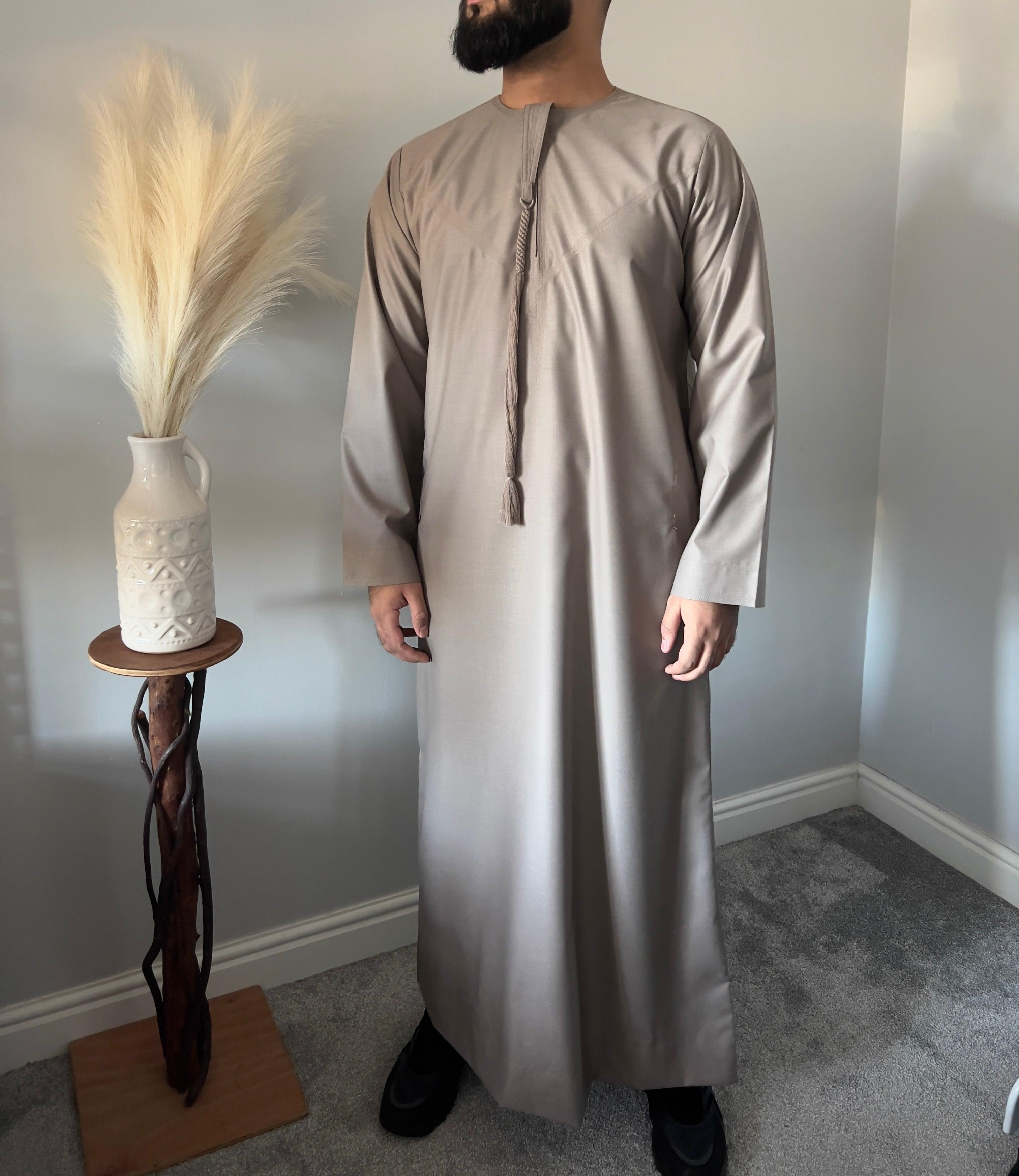 Thobeluxe Men’s Premium Emirati Thobe For Ramadan Taupe shade, part of our exclusive Ramadan Collection. Side Pockets Size 52-60 M to X-Large chest fit 