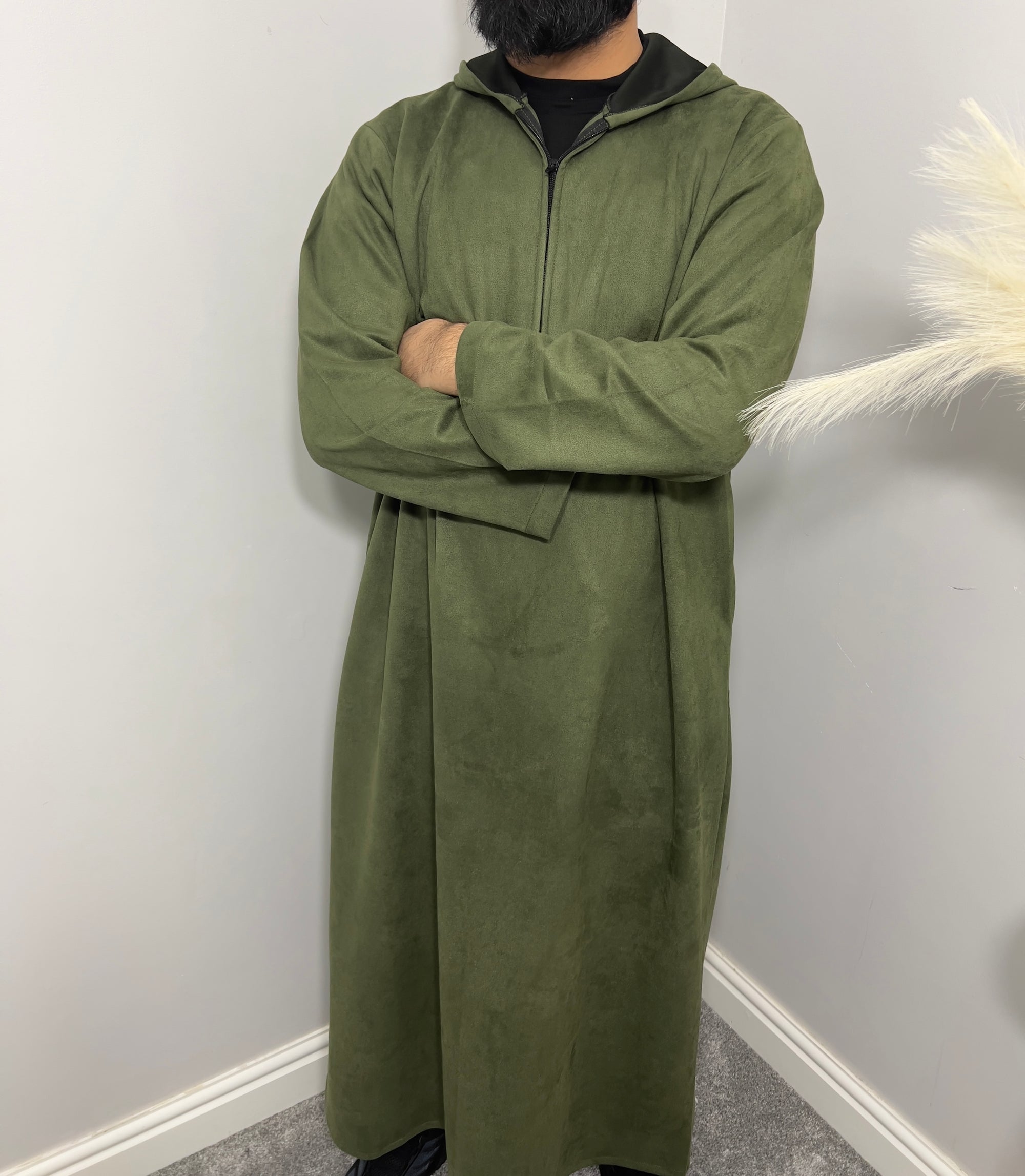 hooded and long sleeve thobe in suede material in green colour worn by man
