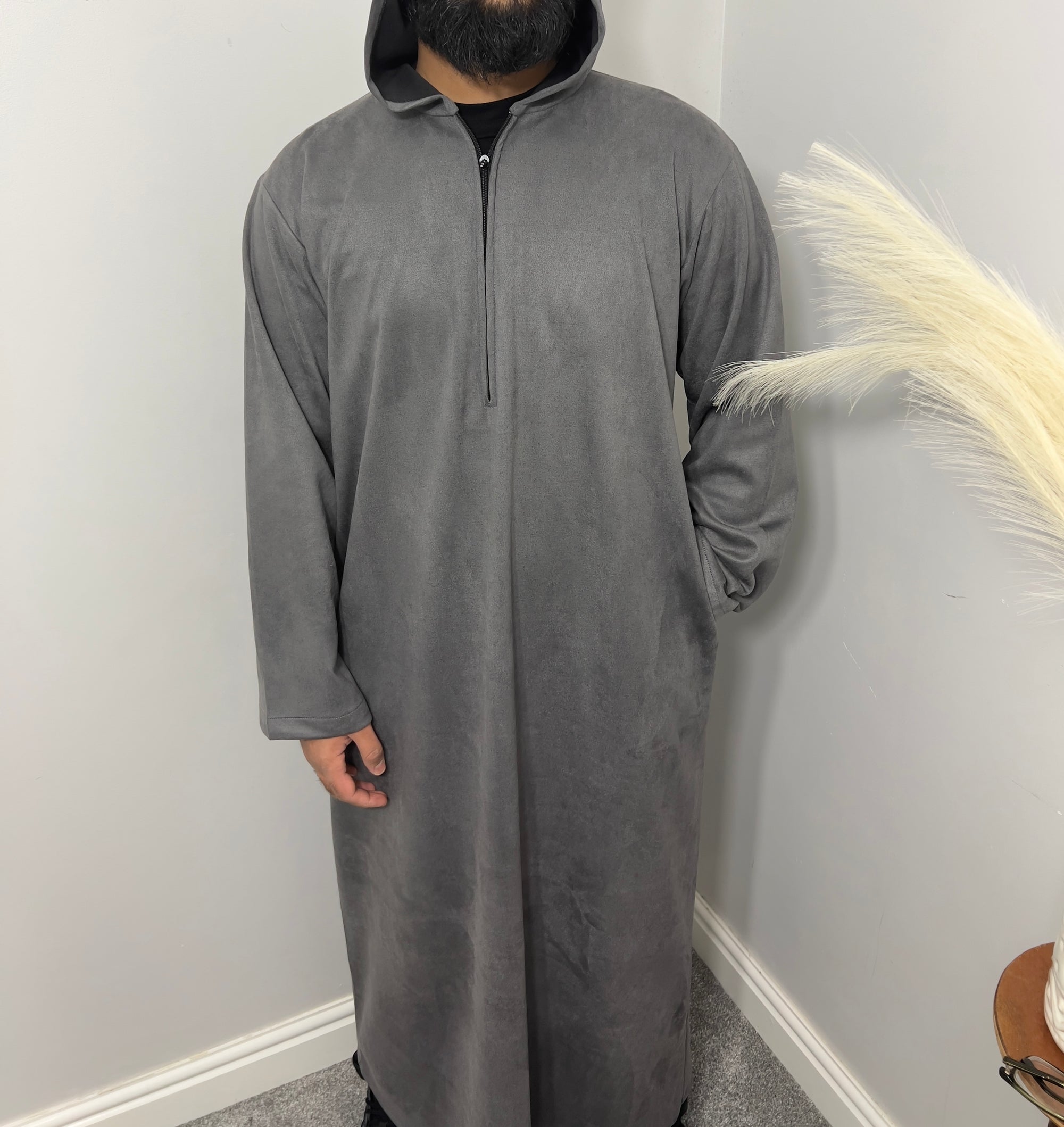 hooded and long sleeve thobe in suede material in grey colour worn by man