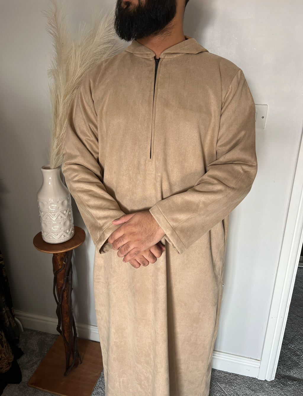 hooded and long sleeve thobe in suede material in beige colour worn by man