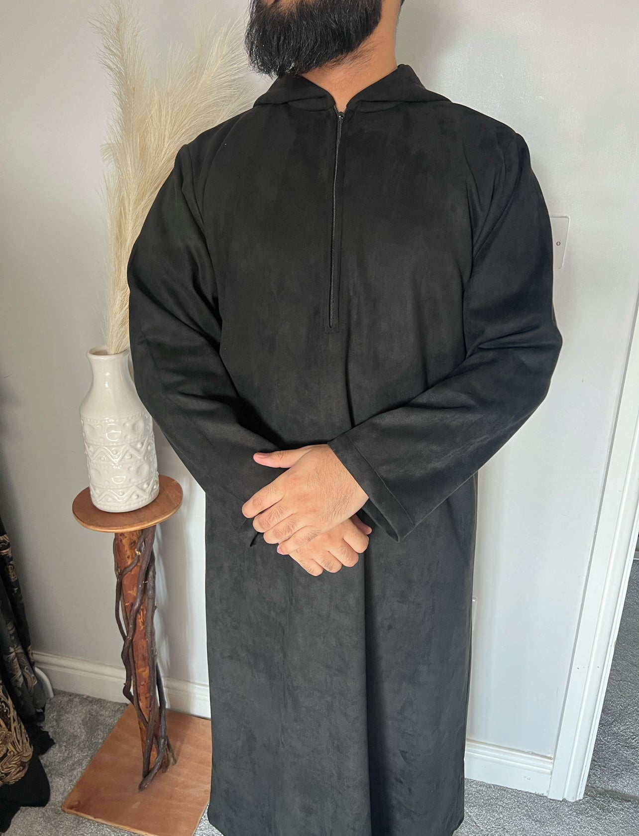 hooded and long sleeve thobe in suede material dark colour worn by man