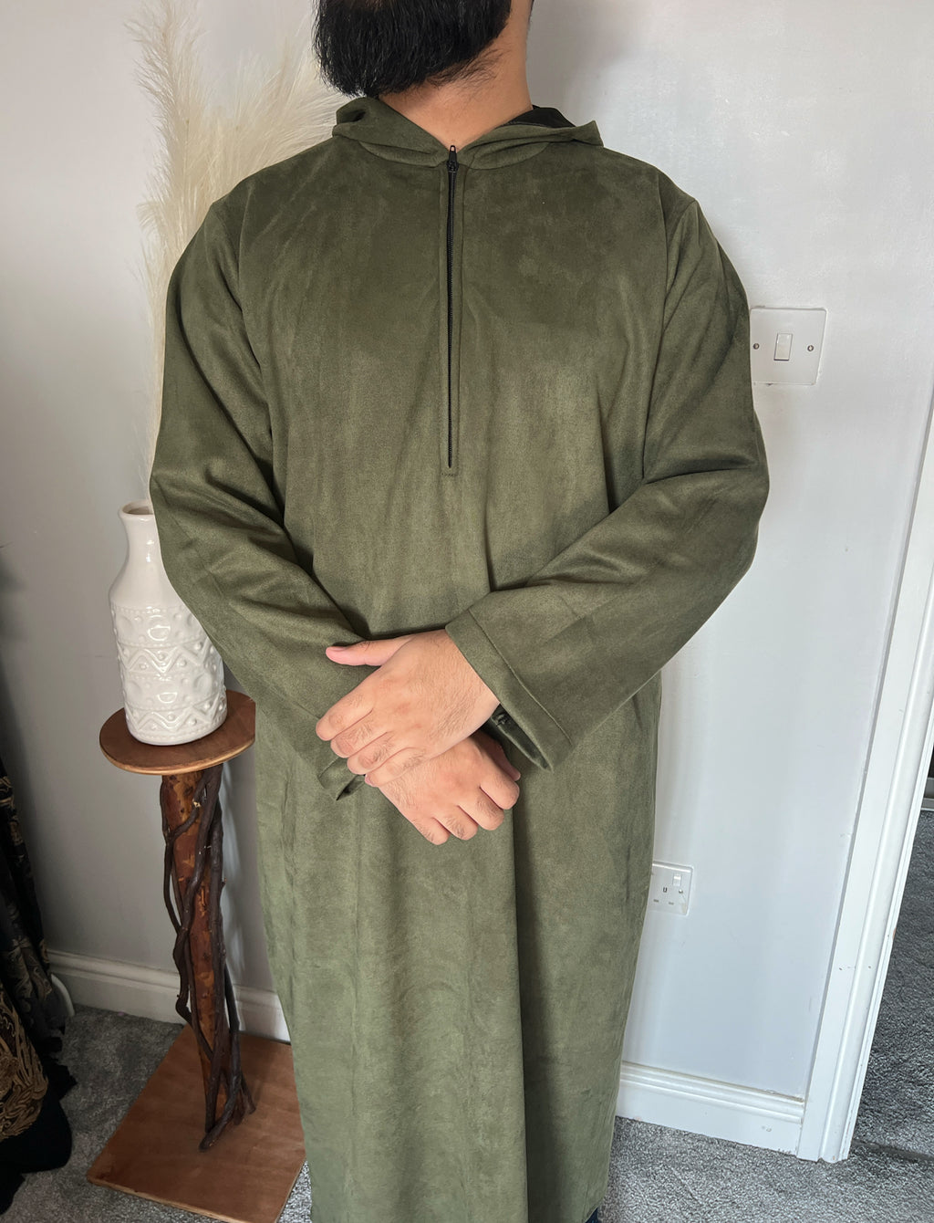 hooded and long sleeve thobe in suede material in green colour worn by man