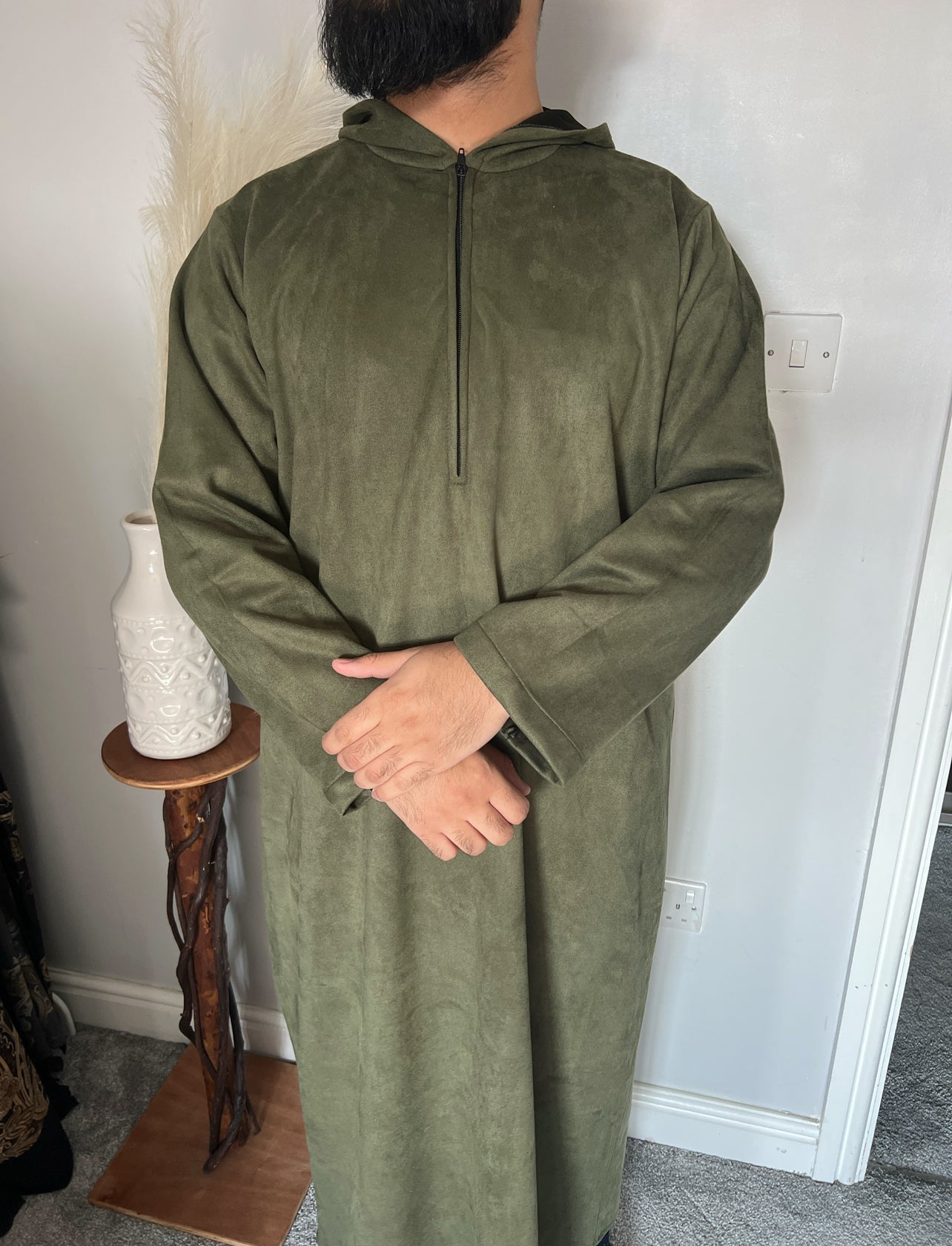 hooded and long sleeve thobe in suede material in green colour worn by man