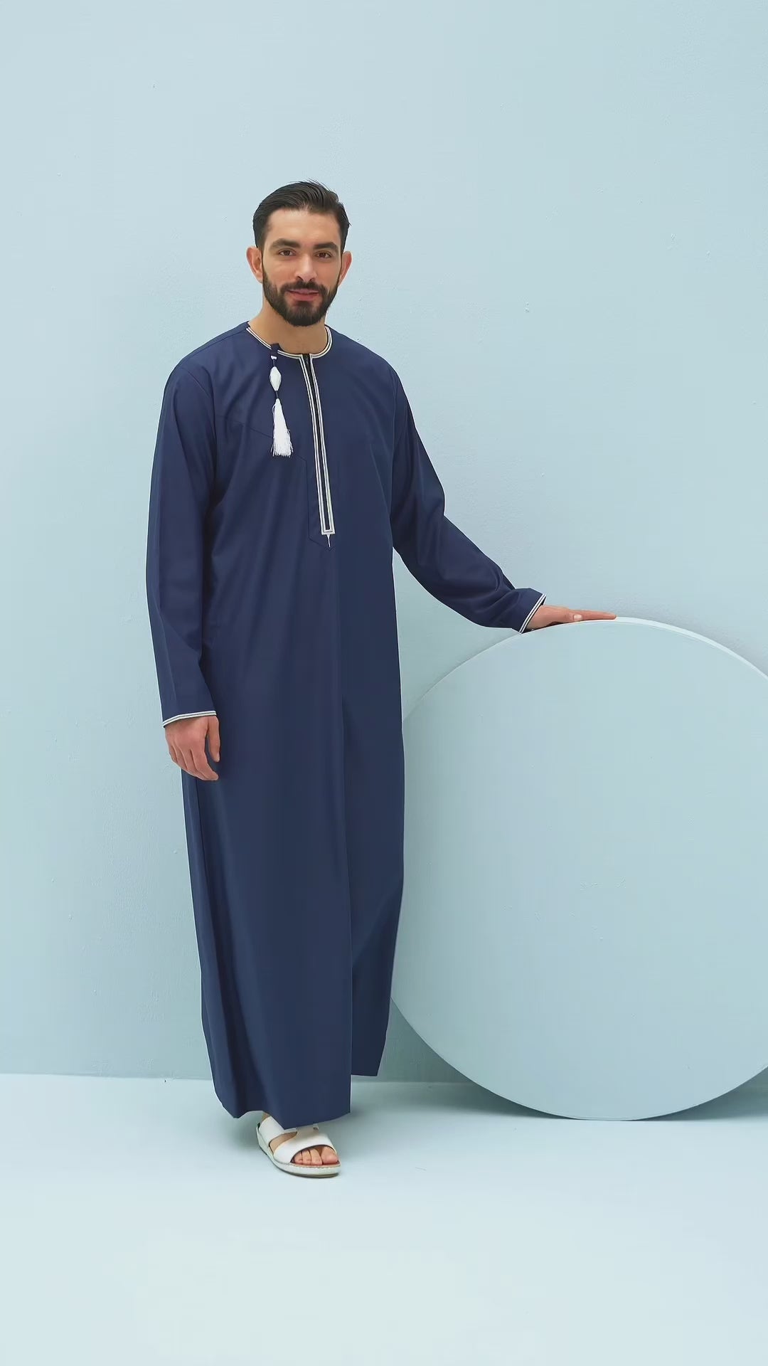 video of man in blue thobe and different coloured thobes being worn by the man